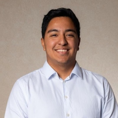 Gerson Montes smiling in a light blue shirt